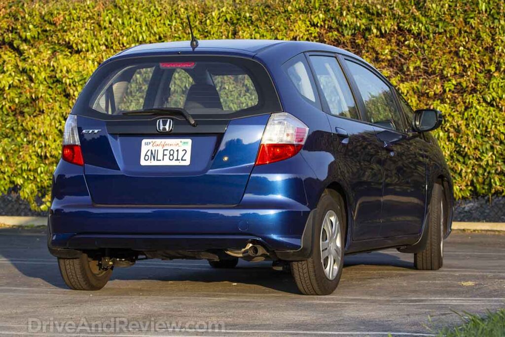 Blue 2010 Honda fit rear three-quarter view