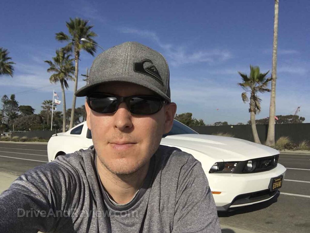 Scott posing with his 2012 Ford mustang GT