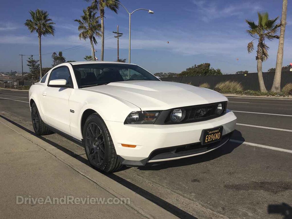 White 2012 Ford mustang GT with palm trees in the background