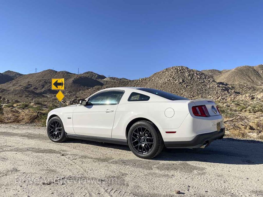 White 2012 Ford Mustang GT on a road trip in Southern California